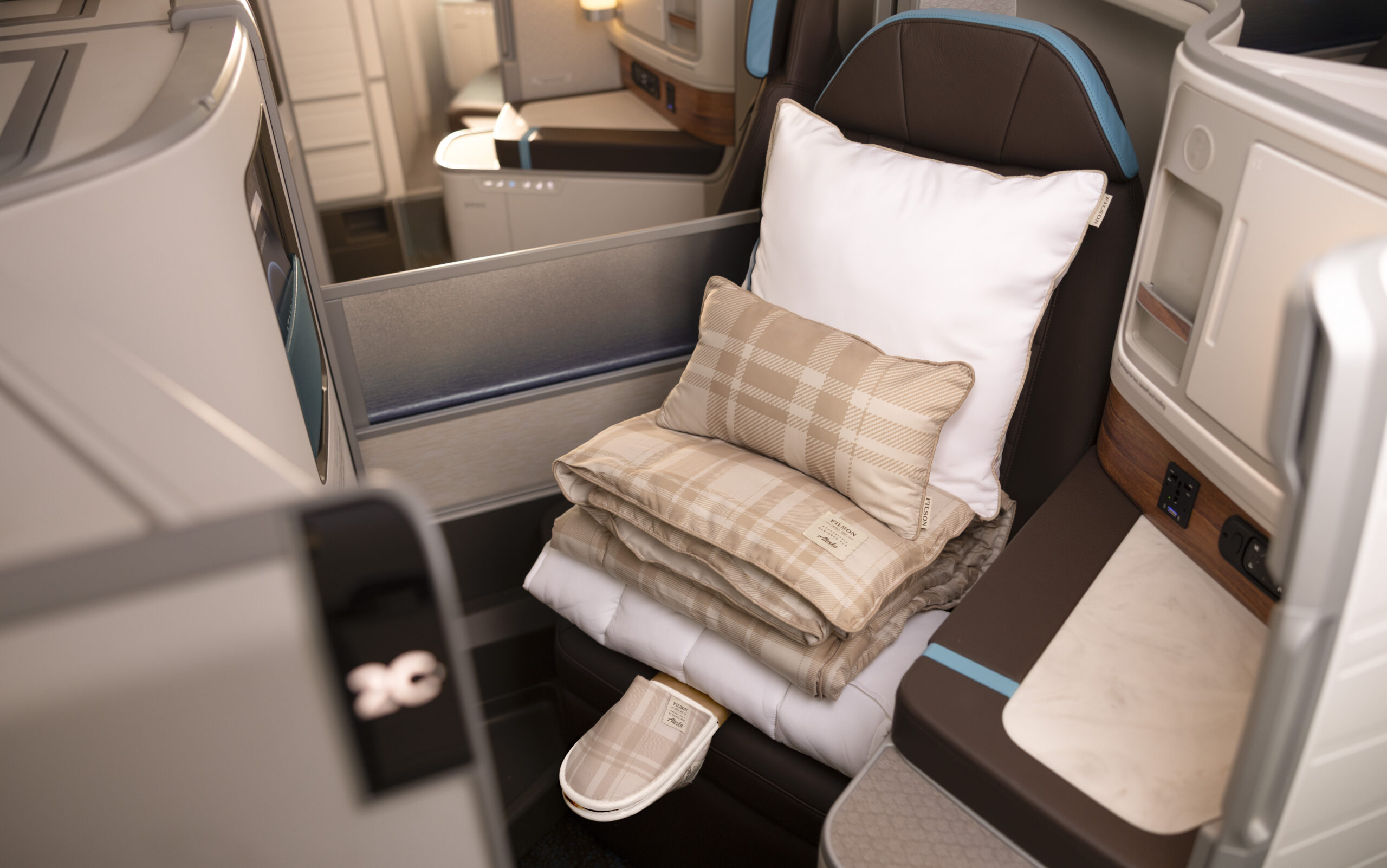 Alaska Airlines international business class Suite on the Boeing 787-9 with lie-flat seat and privacy door