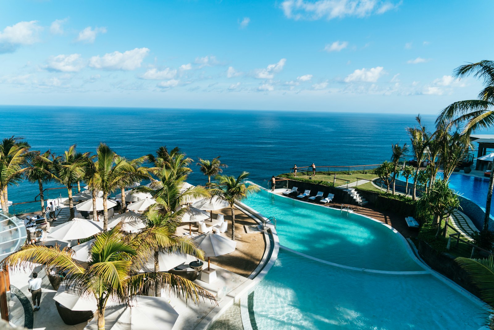 Luxury Caribbean beachfront resort with palm trees and turquoise water