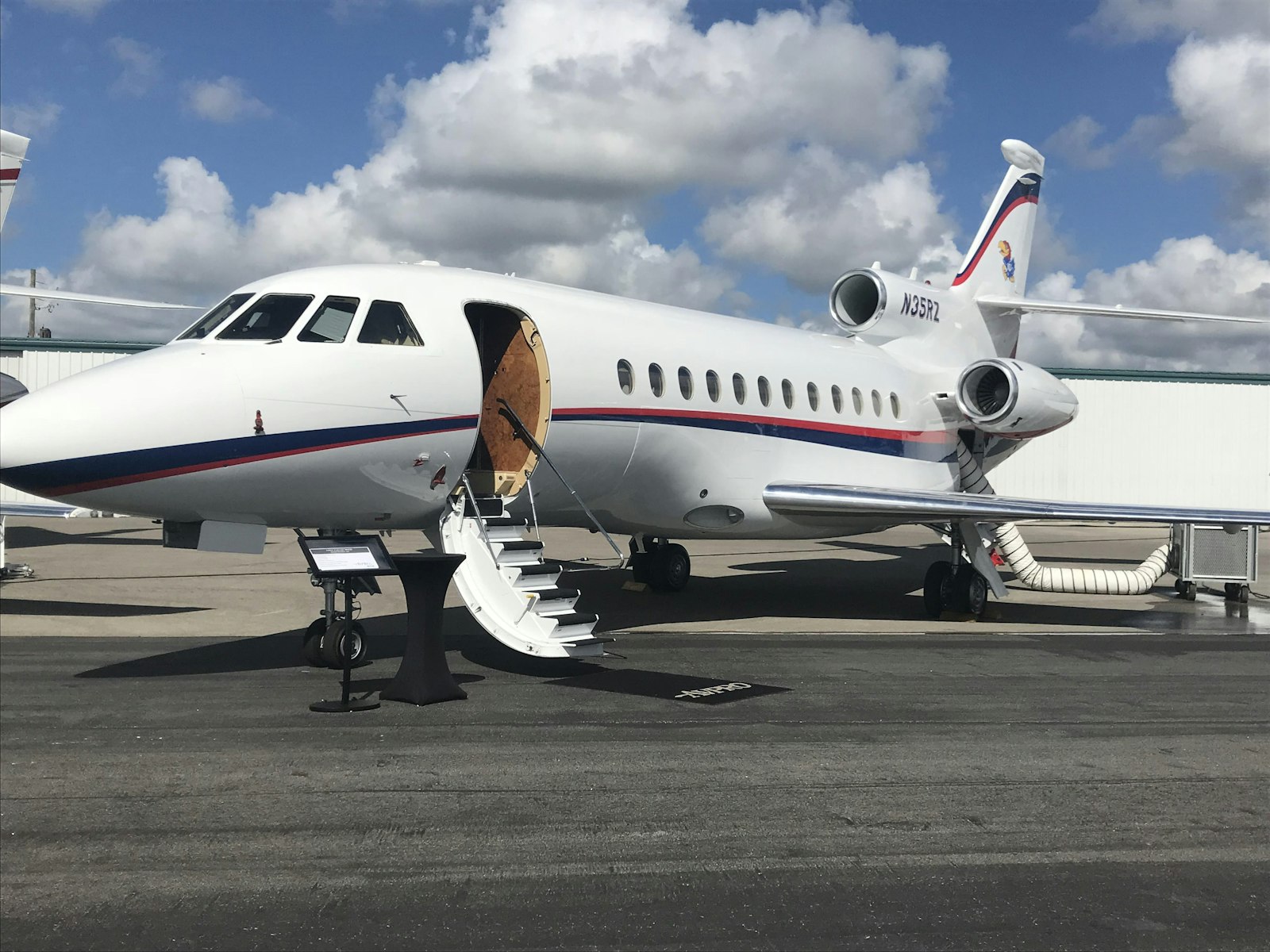 Private jet on runway at dusk — private jet membership vs charter cost